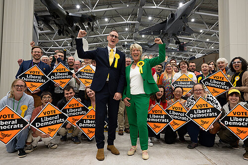 Ian Sollom and Pippa Heylings after the count at Duxford in front of lots of Lib Dems with diamonds