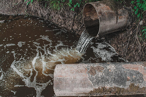 Sewage overflowing into a water course